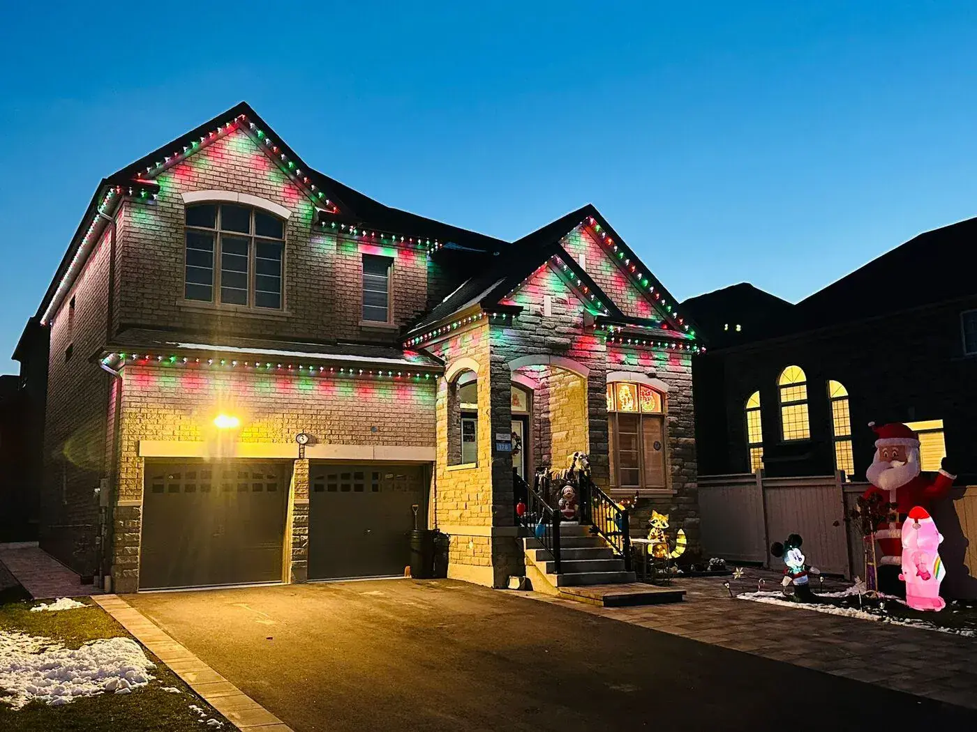 Vancouver home with red and green permanent Christmas LED lights by Vancouver Glow