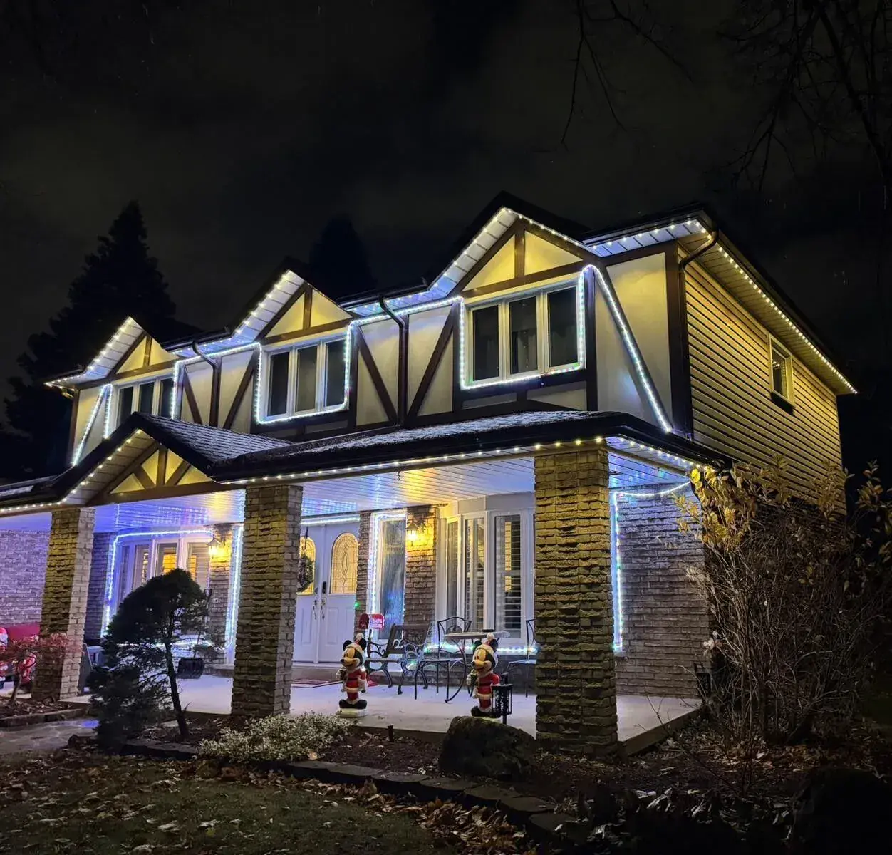 Vancouver home with permanent holiday LED soffit lighting at night by Vancouver Glow
