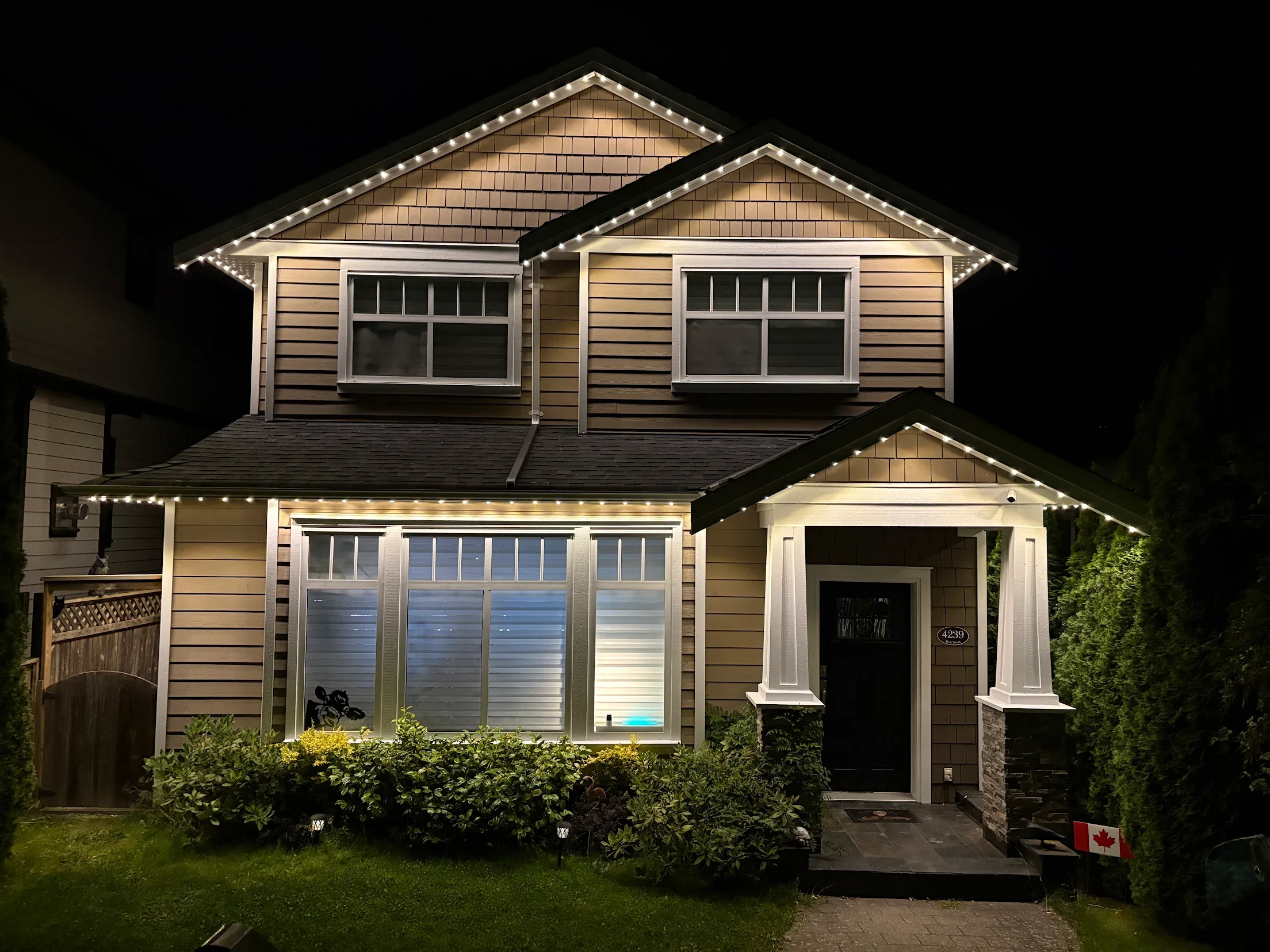 Real Vancouver home using warm-white permanent architectural lighting after Halloween