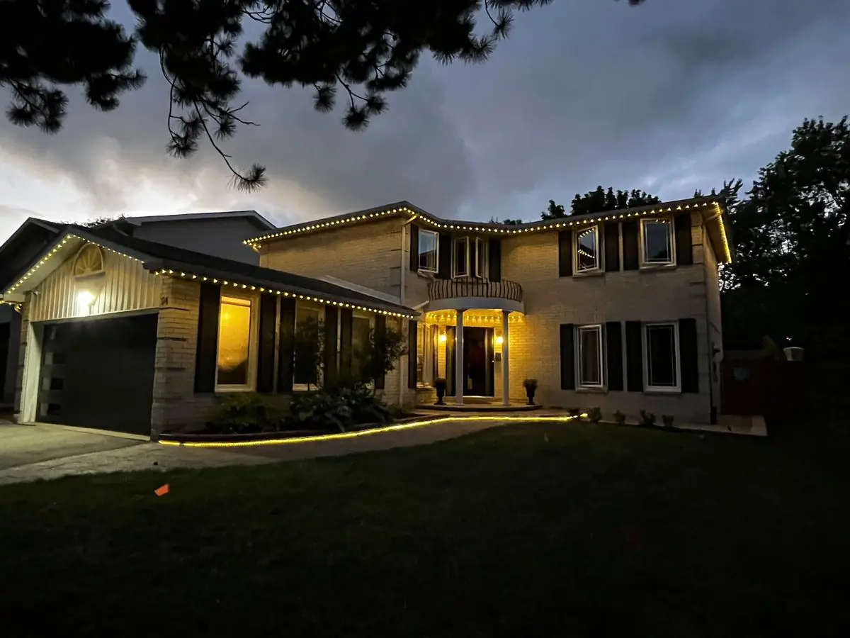 Vancouver home with amber permanent outdoor LED roofline lighting