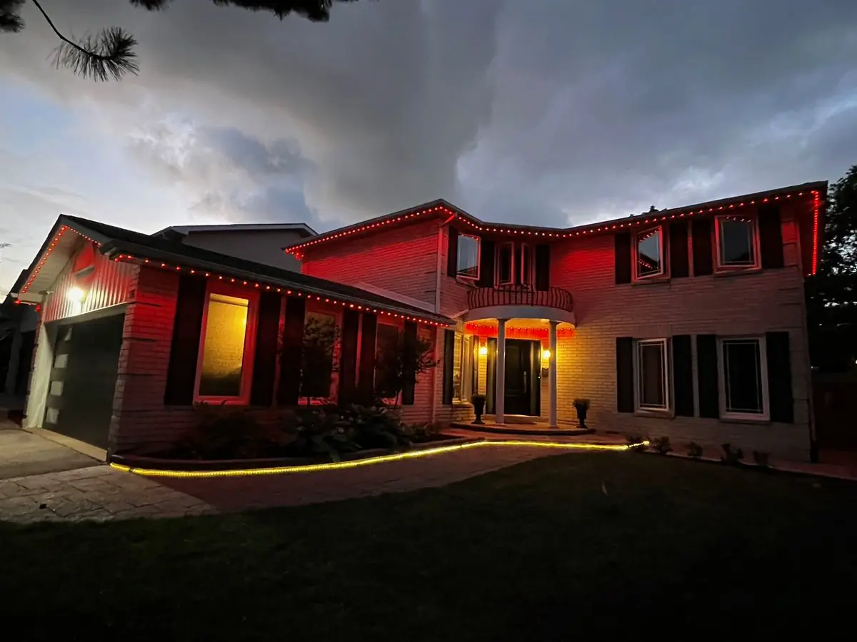 Vancouver home with red accent permanent LED lights on roofline