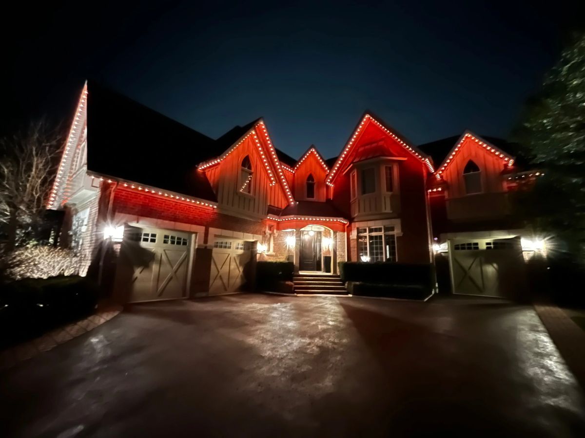 Vancouver home with red and amber permanent LED lights adding curb appeal