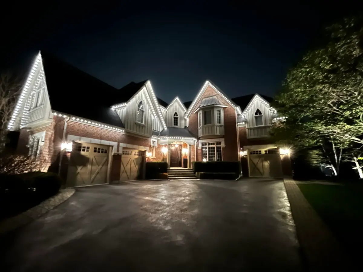 Vancouver home with app-controlled white soffit lighting at night